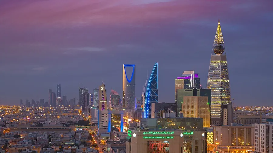 Illustrative photo: a Saudi city skyline at dusk